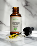 2% Bakuchiol Overnight Oil on white marble with its dropper, a gentle retinol alternative