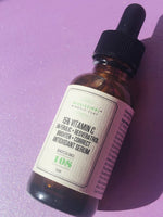 15% Vitamin C Serum styled on purple