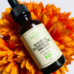8% Polypeptide Collagen Toning Serum on bright marigold flowers