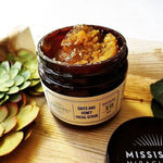 Grits and Honey Facial Scrub jar with botanical styling