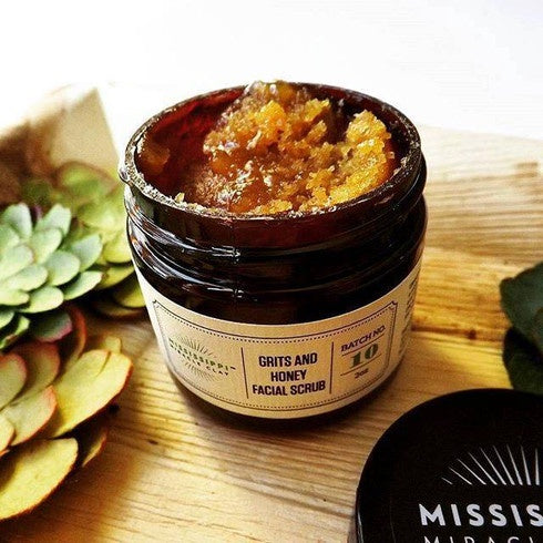 Grits and Honey Facial Scrub jar with botanical styling