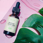 Hair and Scalp Treatment Serum on pink with a tropical leaf