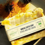 Citrus Turmeric Castile Soap bar with star anise on wood
