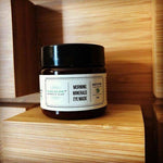 Morning Minerals Eye Mask jar on a wooden block