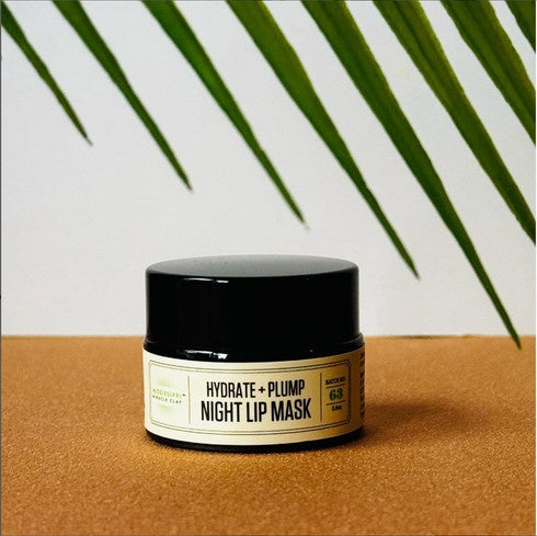 Night Lip Mask jar with a palm leaf