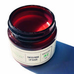 Open jar of Rose Tinted Lip Glaze showing its soft rose color
