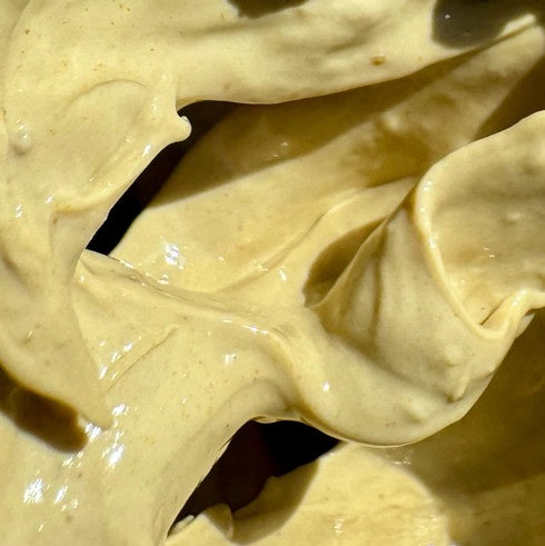 Vitamin C Glow Mud Mask texture, a brightening clay mask